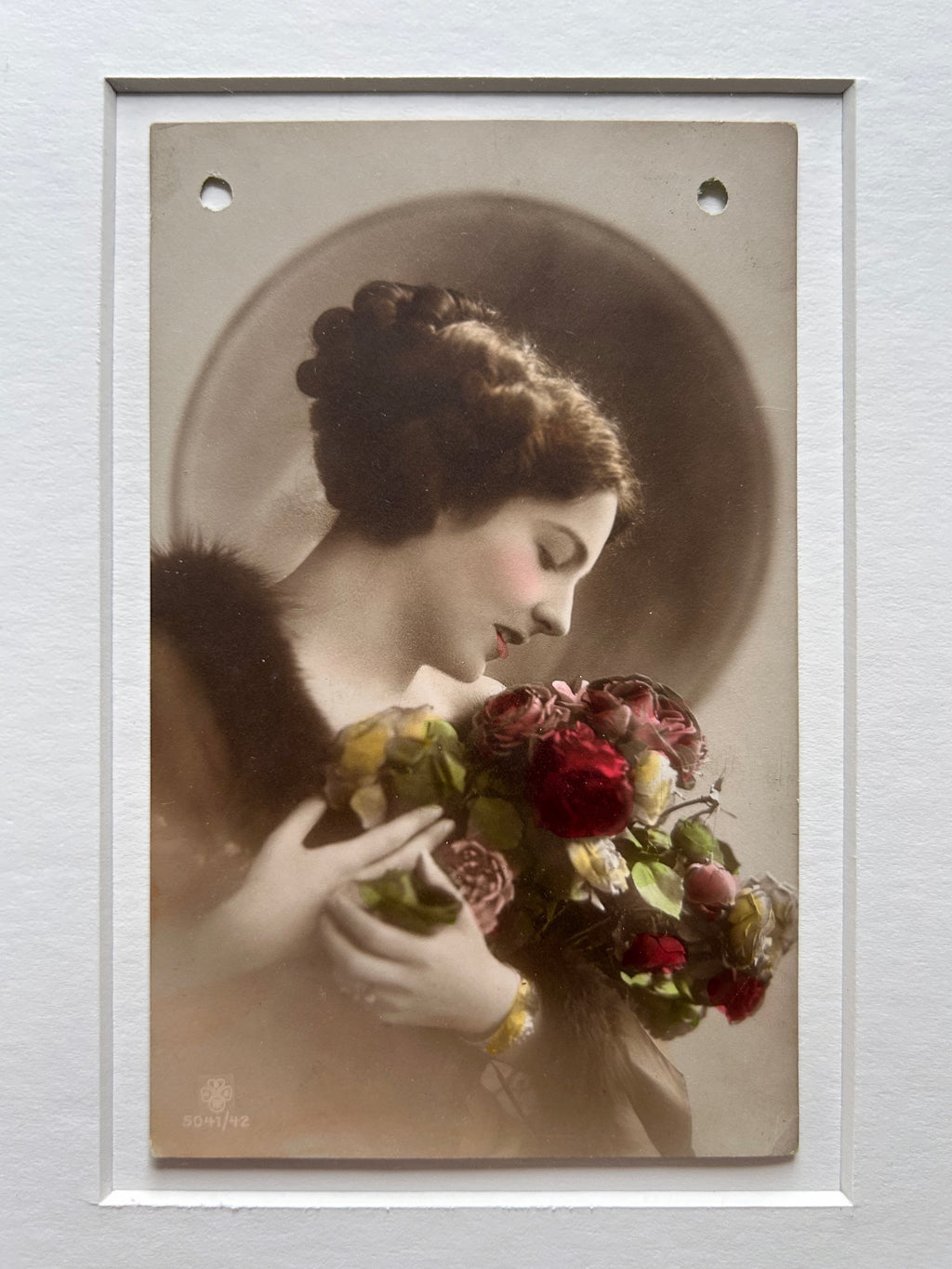 By any other name - Framed 1920s Hand-Colored Postcard with a Vintage soft portrait of a woman holding flowers Parisian Portrait in a handmade Merbau wood Frame