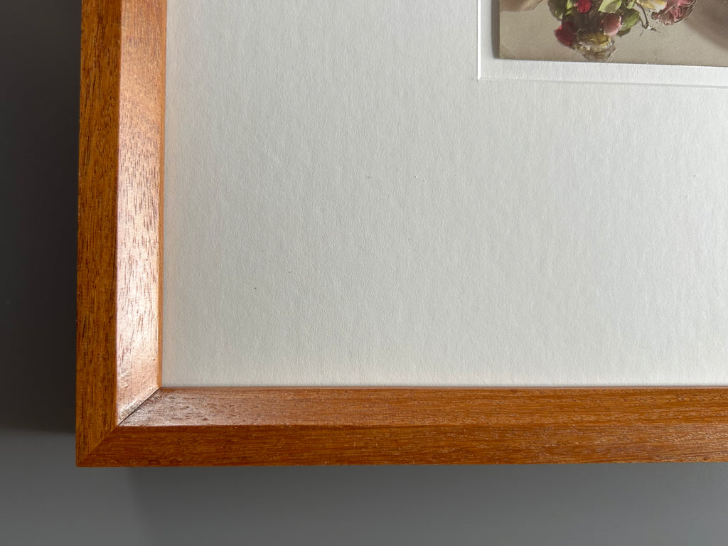 By any other name - Framed 1920s Hand-Colored Postcard with a Vintage soft portrait of a woman holding flowers Parisian Portrait in a handmade Merbau wood Frame