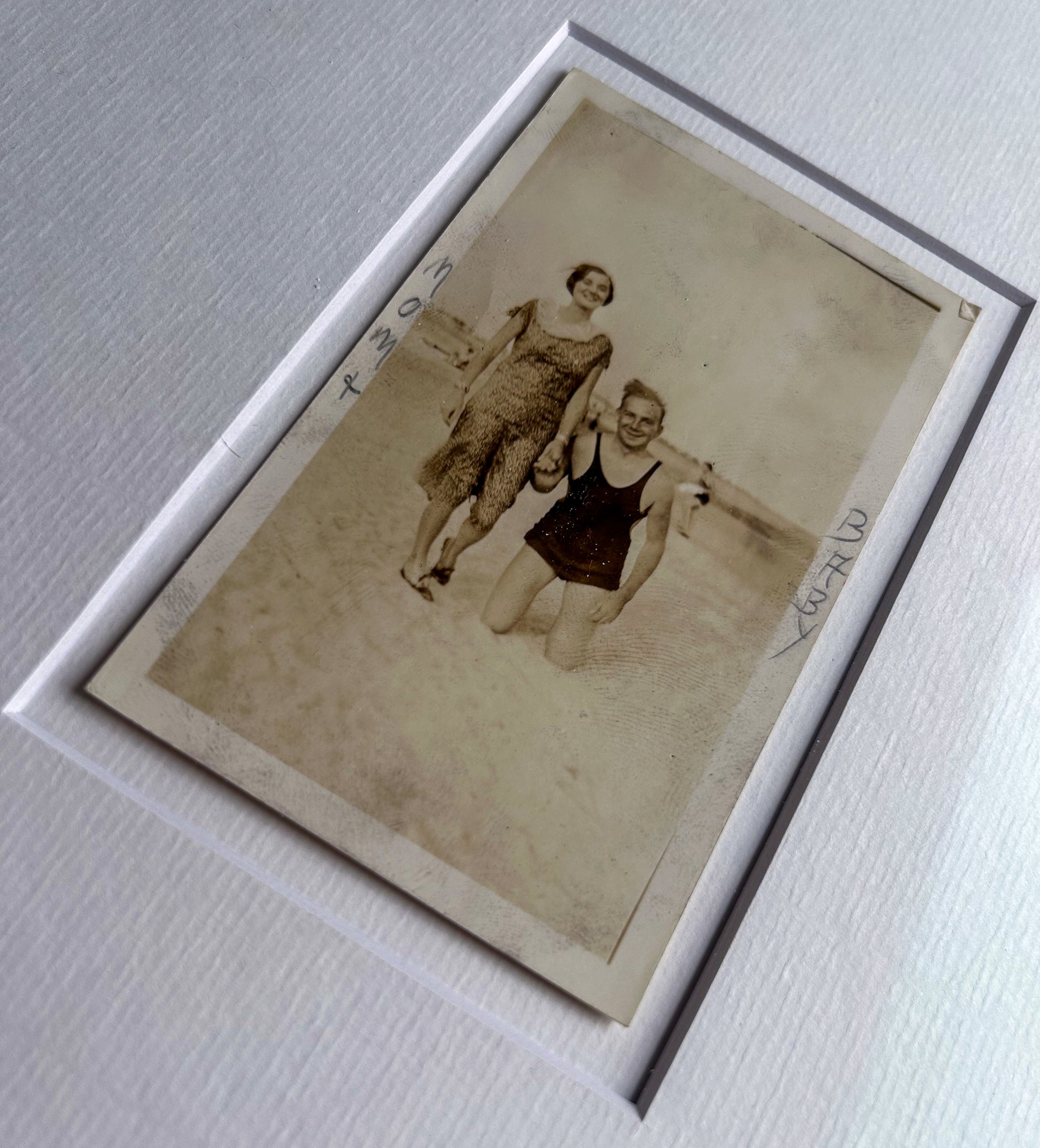 Mom + baby - Framed 1950s B&W "Mom + Baby" Photo featuring a standing woman and a man on his knees – Vintage Silver Gelatin Print in Custom Frame