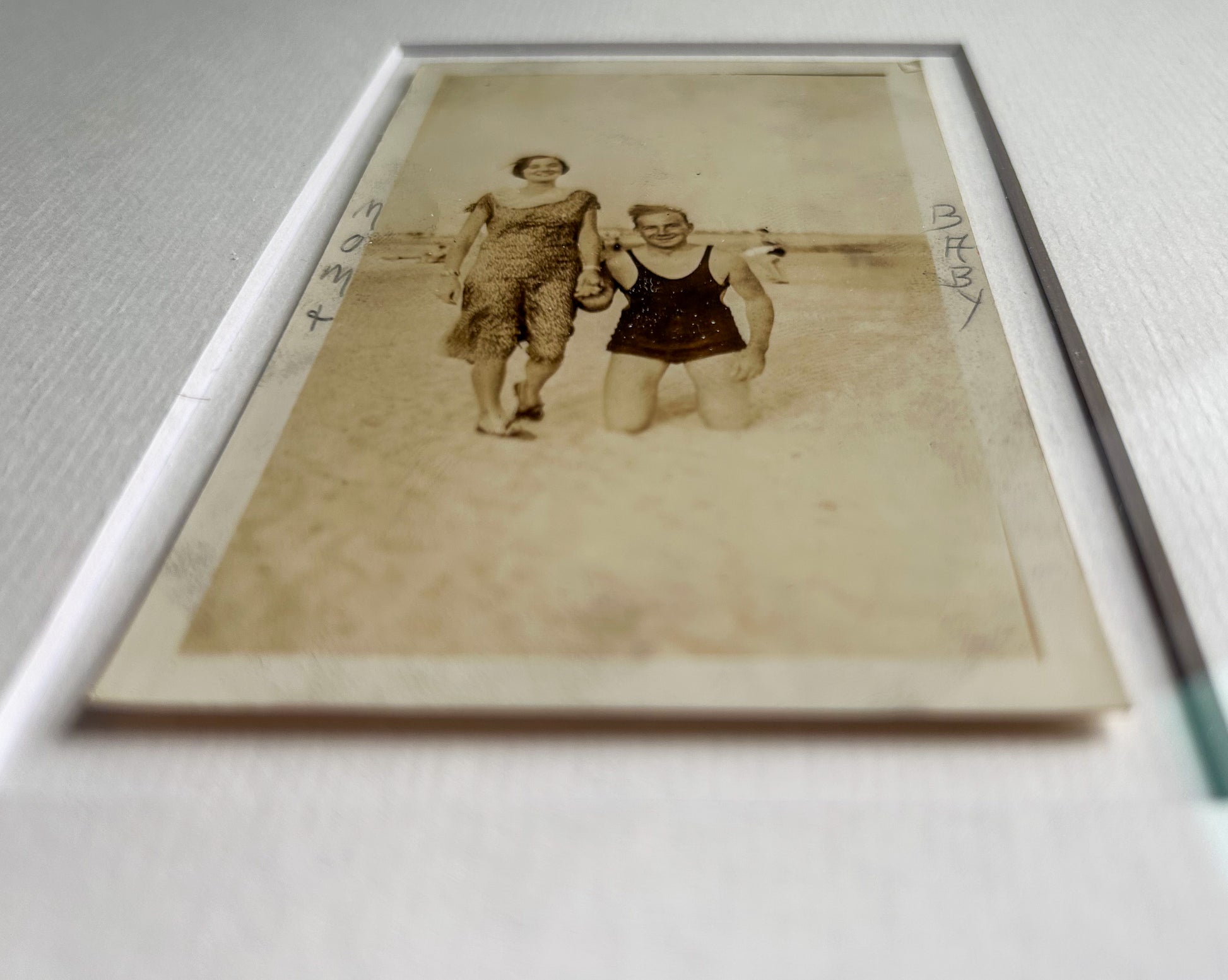 Mom + baby - Framed 1950s B&W "Mom + Baby" Photo featuring a standing woman and a man on his knees – Vintage Silver Gelatin Print in Custom Frame