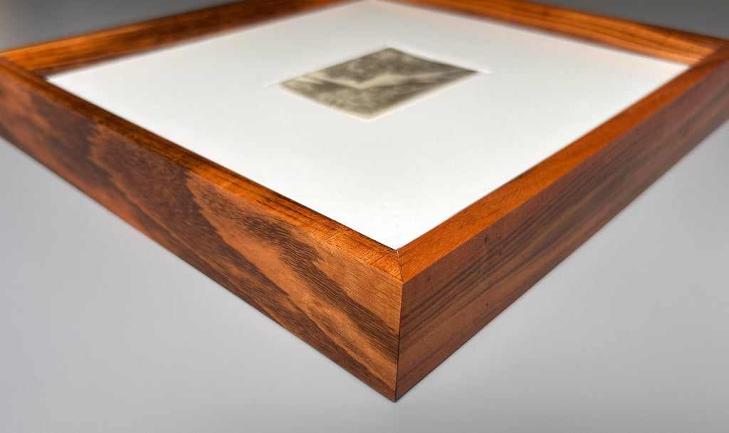 Unarmed - Framed Vintage Nude Photo – 1950s Outdoor Reclining Figure in Jatoba Wood