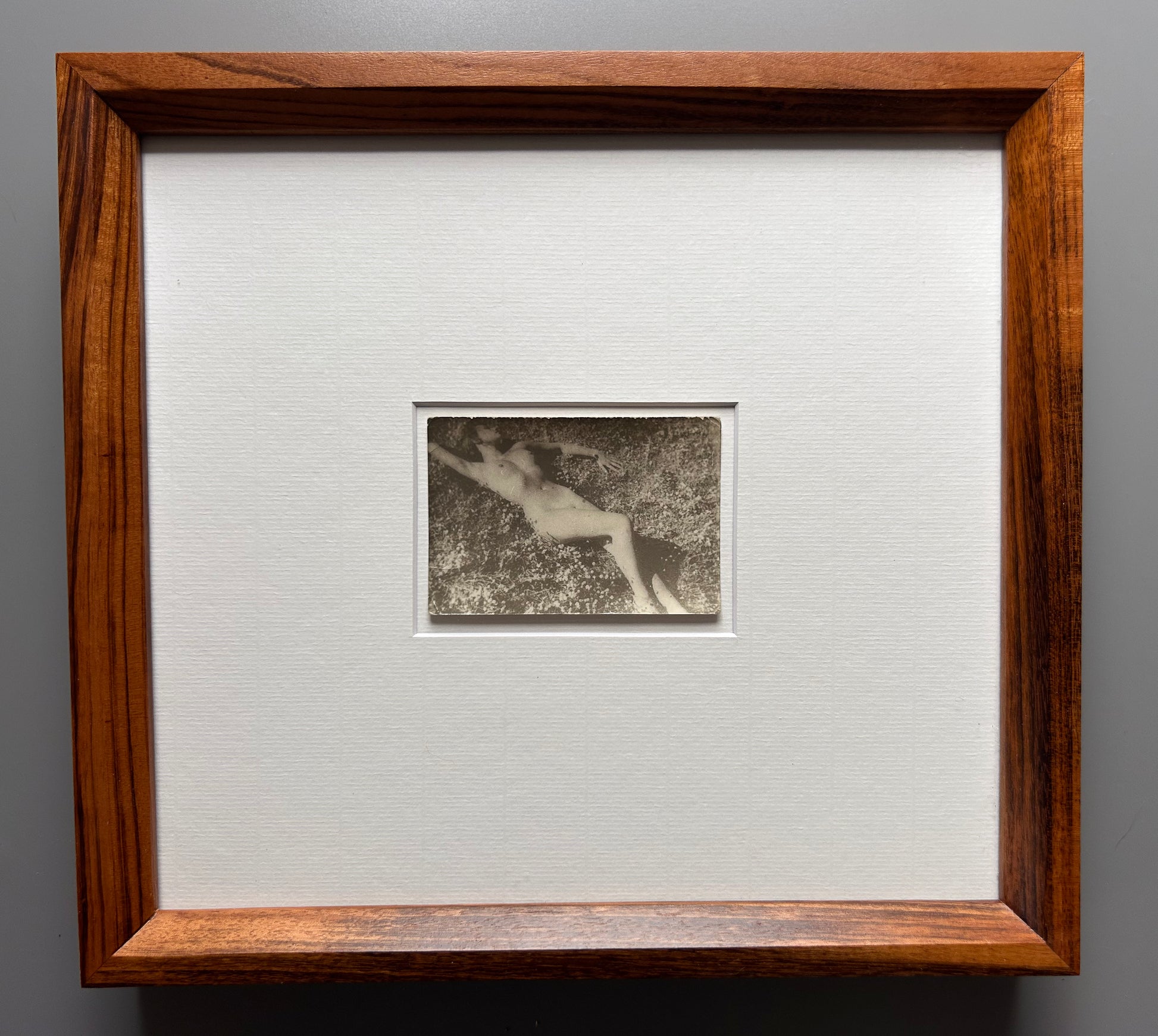 Unarmed - Framed Vintage Nude Photo – 1950s Outdoor Reclining Figure in Jatoba Wood