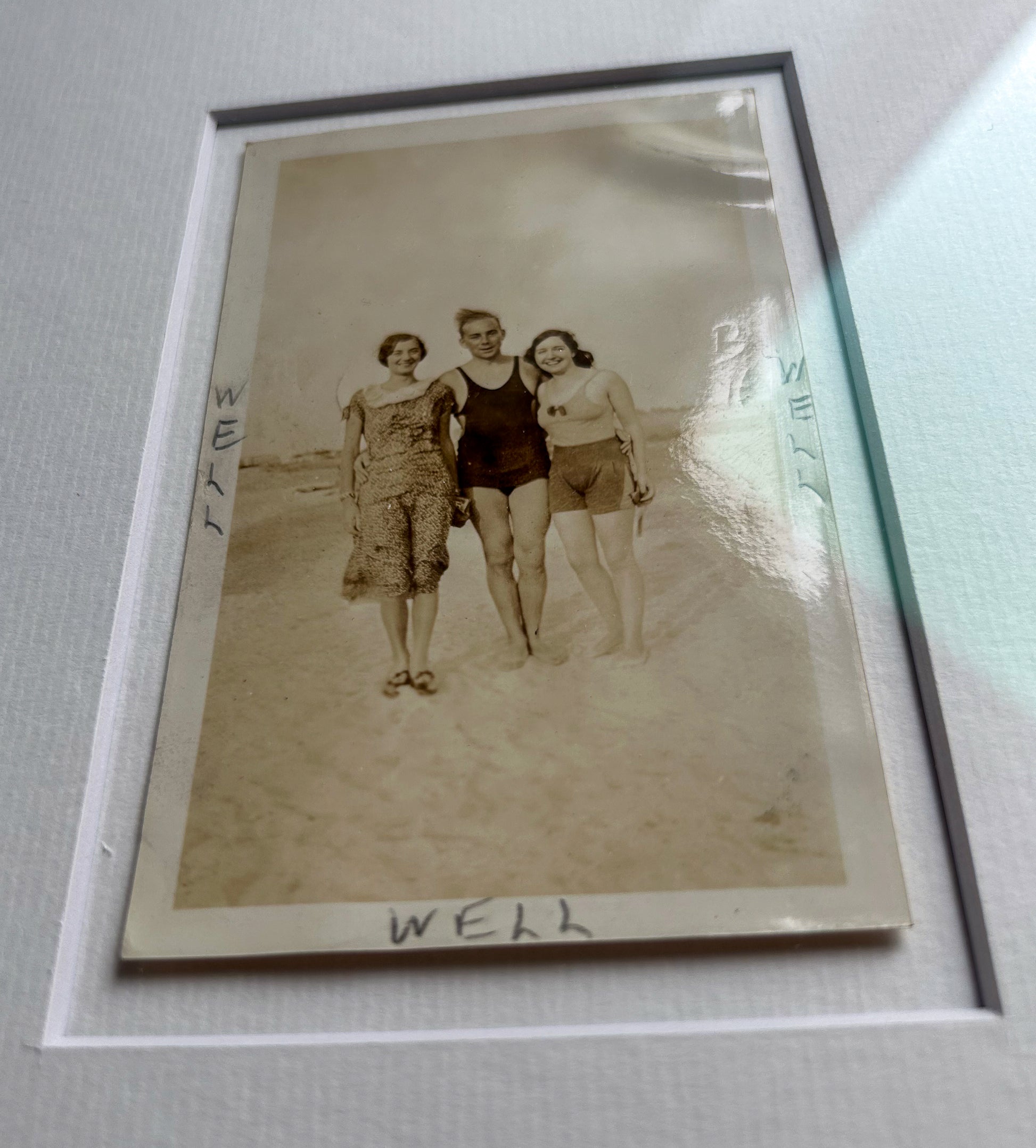 Well, well, well - handmade Framed Vintage Photo featuring a man standing with two women with handwritten Text – 1950s B&W Art Print: "Well Well Well"